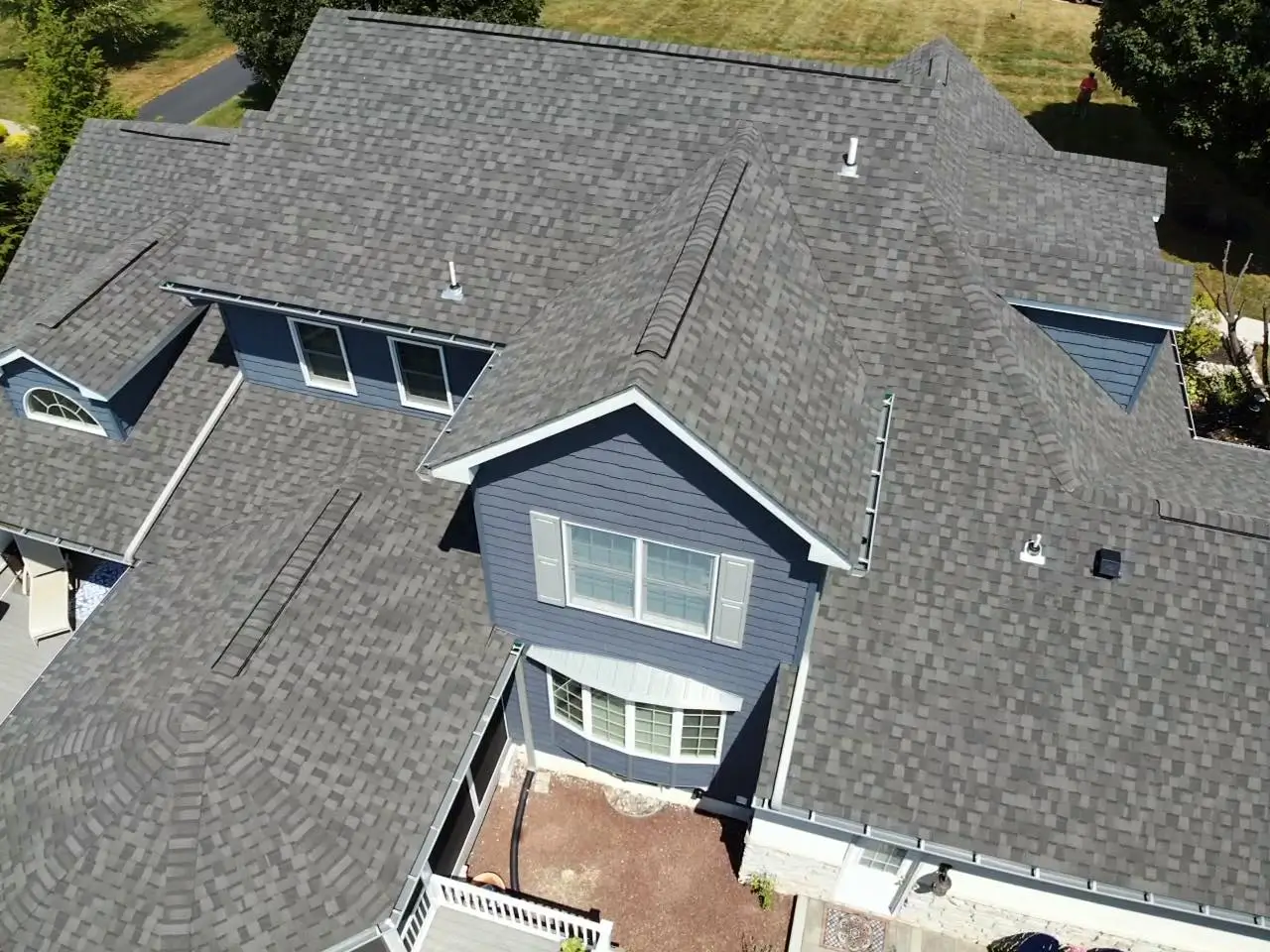 luxury home with newly installed asphalt shingles