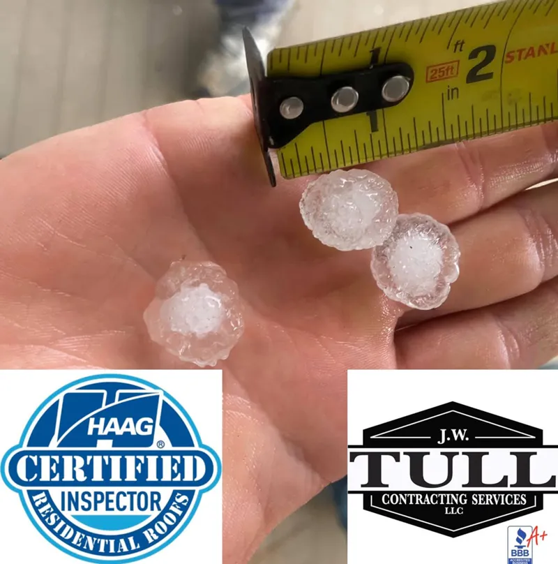 hand holding hail pieces and measuring them
