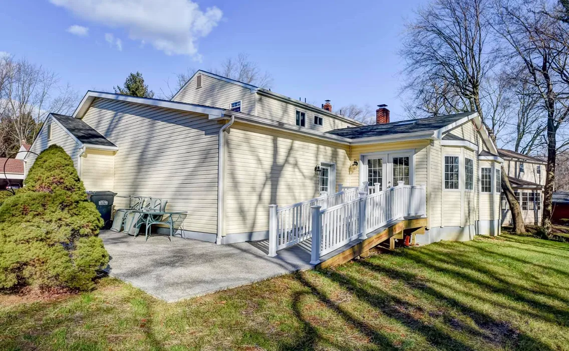 home remodeled with new siding, roof, and deck