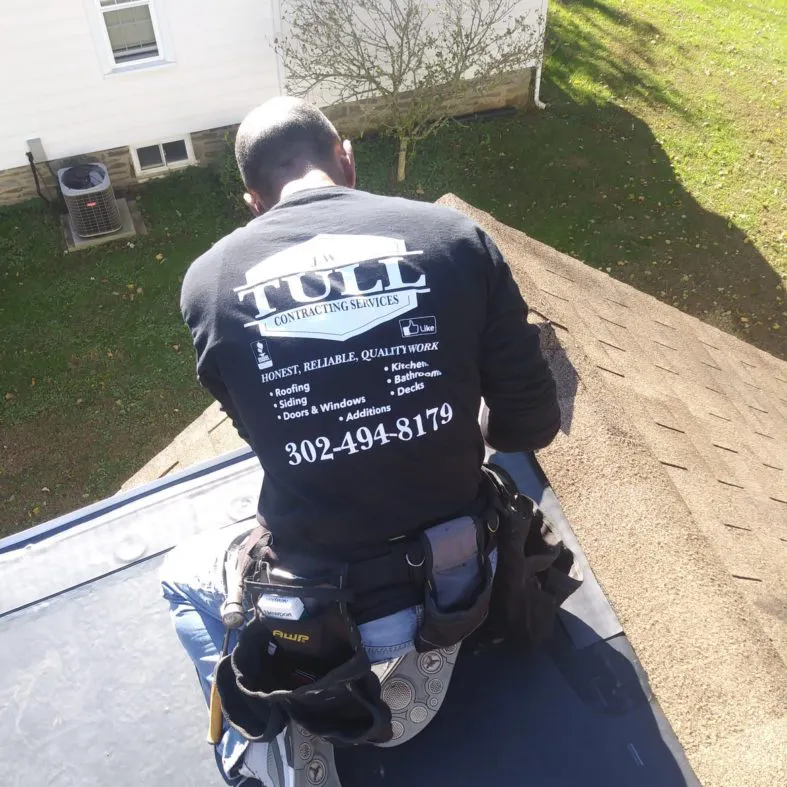 Roof Repair Technician Repairing Roof