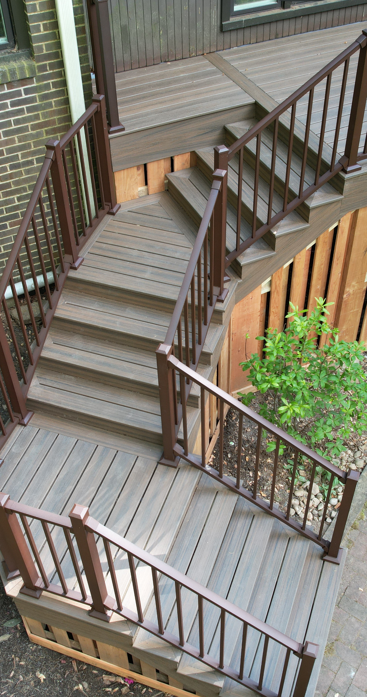 Staircase connecting multiple levels of a residential deck